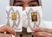 Harga Emas Antam Hari Ini 14 Oktober 2026 Stagnan — Ilustrasi emas batangan Antam dengan harga stagnan Rp 2.574.000 per gram dan buyback Rp 2.383.000