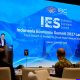 Logo Indonesia Economic Summit 2027 dengan latar biru dan teks IES 2027 Fokus Dampak Sosial Pertumbuhan Ekonomi